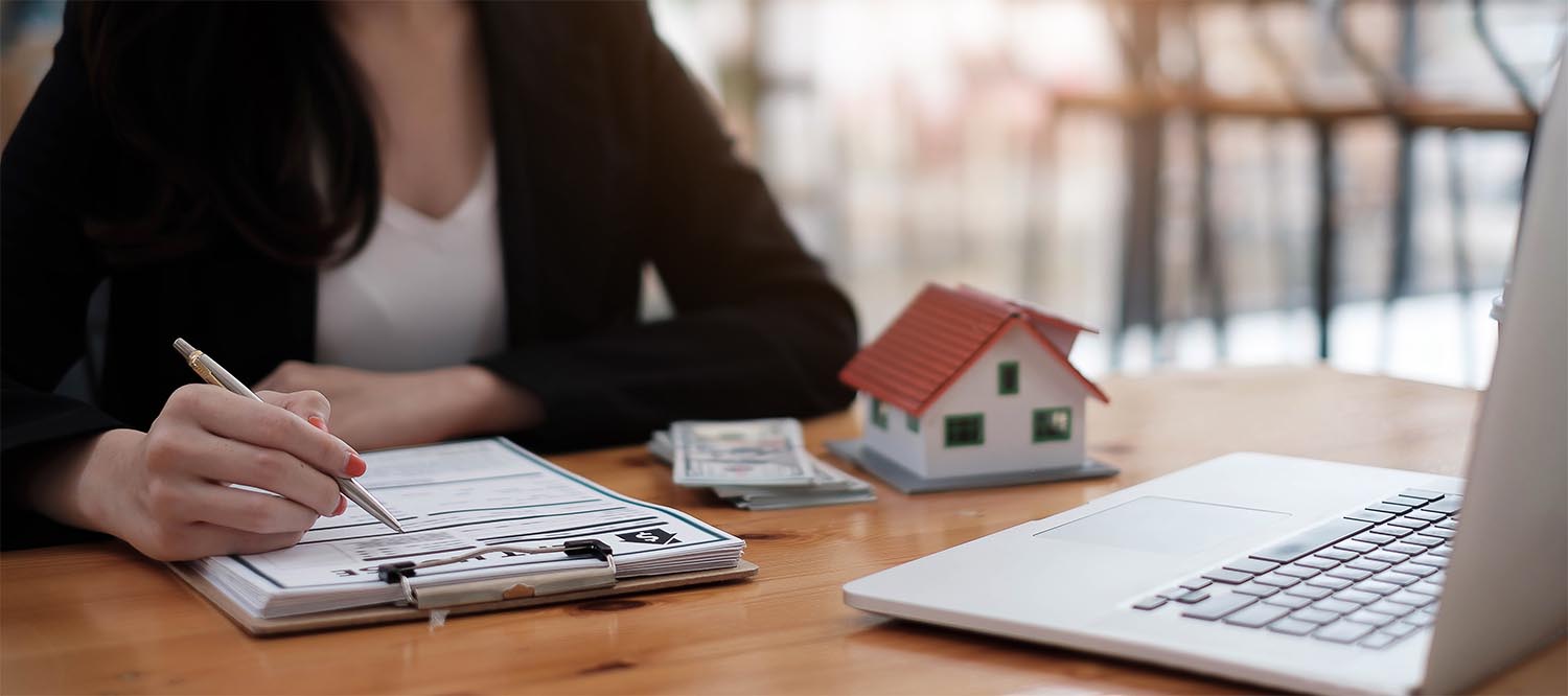 close-up view hands of businesswoman signing leasing home docume